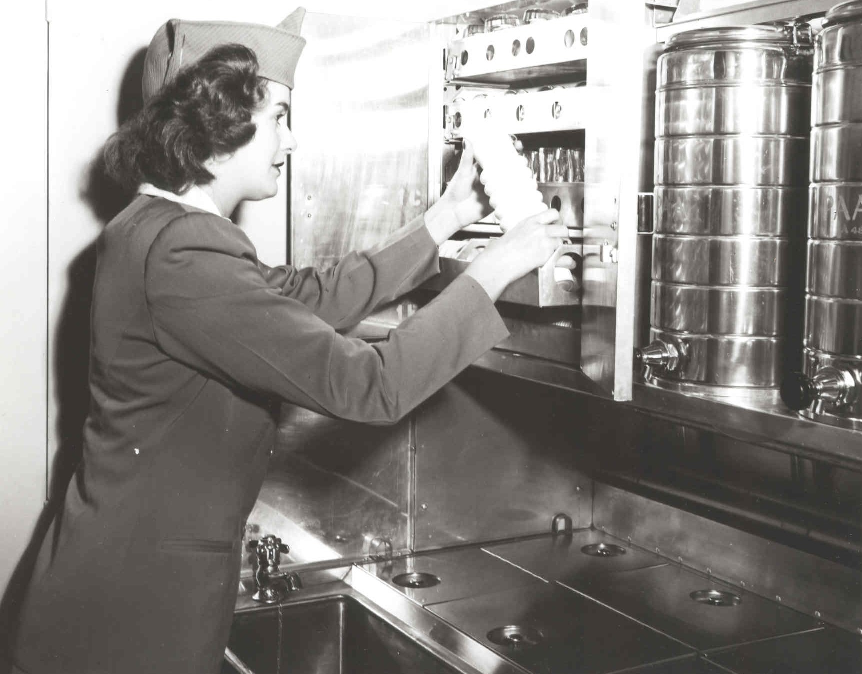 1940s A Stewardess working  in the galley of a Lockheed Constellation.